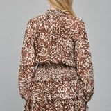 FLIRTY ALLURE ANIMAL PRINT SMOCKED DRESS
