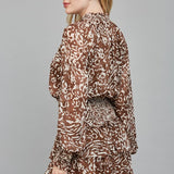 FLIRTY ALLURE ANIMAL PRINT SMOCKED DRESS