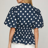 TAKE IN THE SIGHTS NAVY ZIP FRONT POLKA DOT BLOUSE