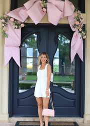 UPSCALE CHARM IVORY ROMPER WITH BOW IN BACK