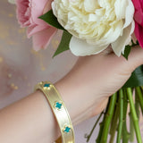 LET IT SHINE BRUSHED GOLD AND TURQUOISE CLOVER BANGLE