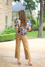 PLOT TWIST PLEATED BOTANICAL BLOUSE