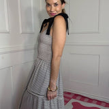A LITTLE GETAWAY SHOULDER TIE SMOCKED TIERED MAXI DRESS