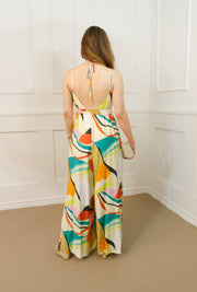 PASSPORT TO PARADISE HALTER JUMPSUIT