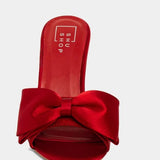 LADY IN RED SATIN HEELS