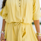 THE GILDED ESCAPE SMOCKED ROMPER